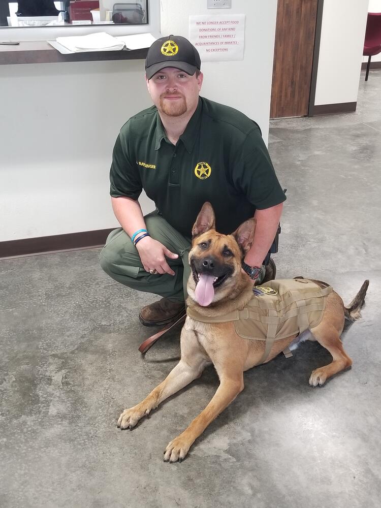 Searcy County Deputy Joey Baysinger with his K-9 partner, Vader.