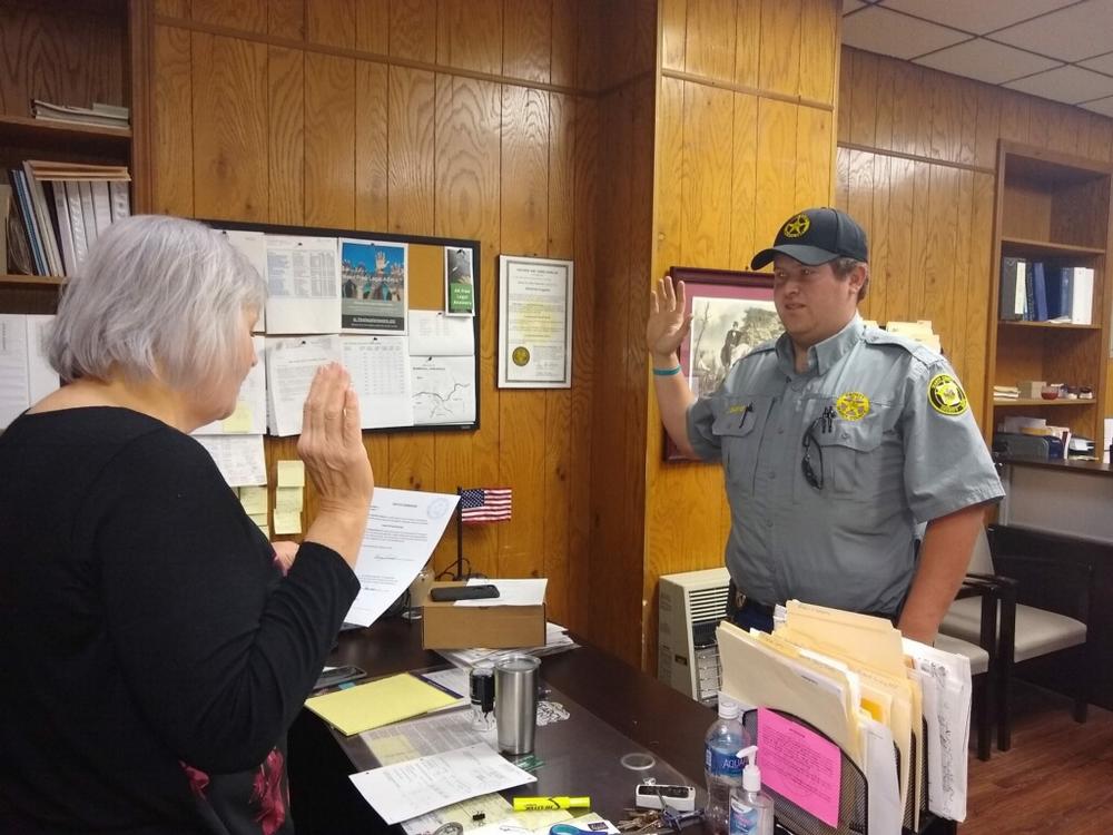 Searcy County’s newest deputy, Joey Baysinger, being sworn in at the Searcy County Courthouse.