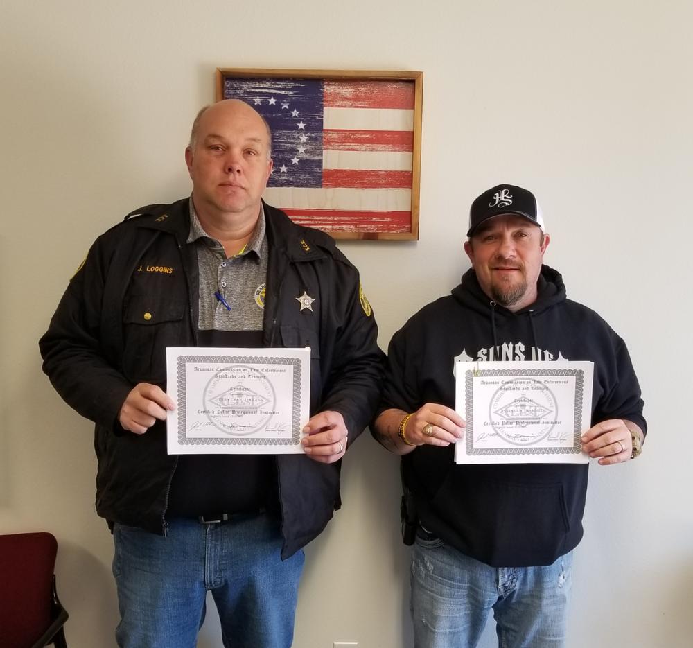 craig loggins and kevin trammell with certificates