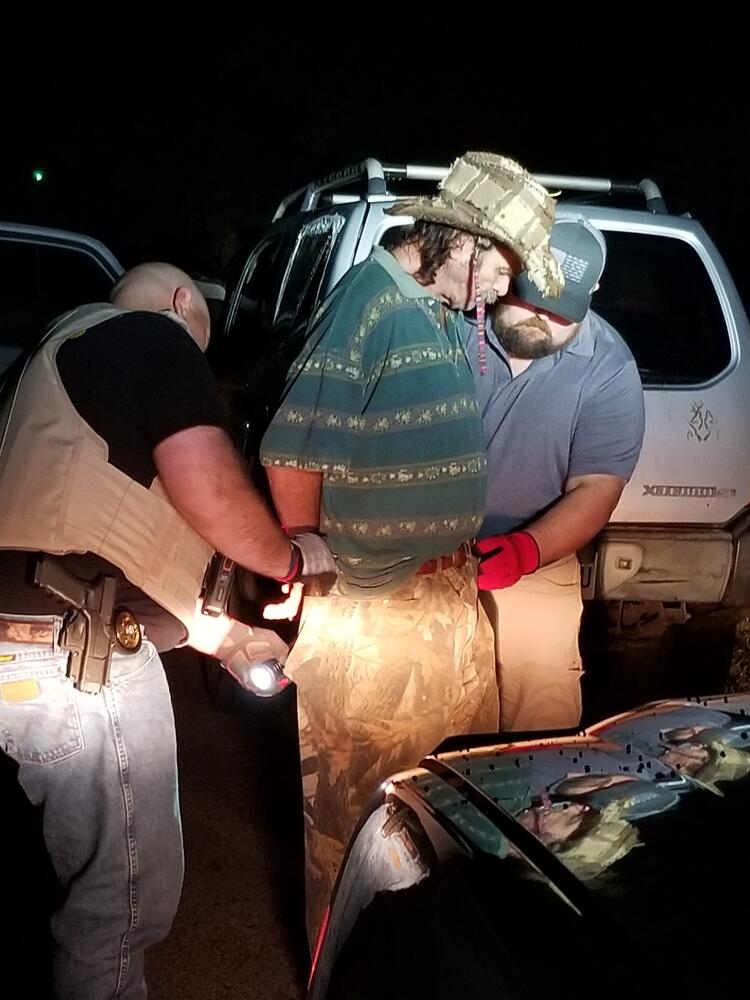 Searcy County Deputy Troy Dye and Searcy County Deputy Justin Flint searching and arresting Jackie Ragland.