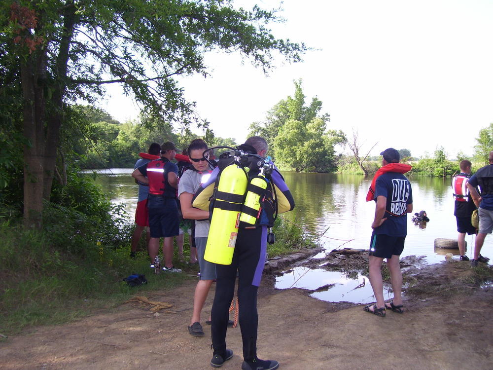 Members of dive team putting gear on